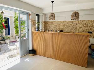 a kitchen with a wooden counter in a house at LUPA ALAÇATI in Çeşme