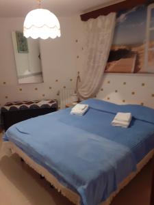 A bed or beds in a room at Affittacamere GERANI