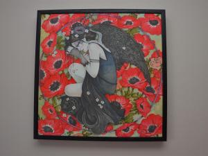 a painting of a woman with red flowers at Belle Vue Guesthouse in Glastonbury +17 photos
