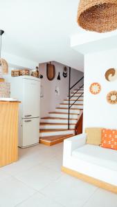 a living room with a white couch and stairs at LUPA ALAÇATI in Çeşme +28 photos