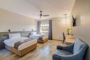 Postel nebo postele na pokoji v ubytování N1 Hotel Rotten Row Harare + 22 fotografií