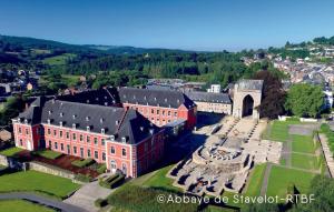 an aerial view of a large building with a courtyard at La Pierre du Diable in Stavelot