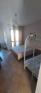 Postel nebo postele na pokoji v ubytování Villa Madani + 12 fotografií