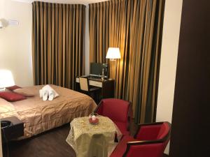 Letto o letti in una camera di Gullo Hotel