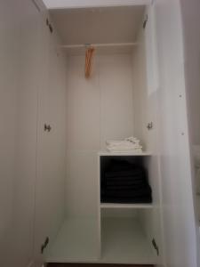 a white walk in closet with white walls at Quartier Langenstrich in Neunkirchen