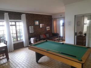 a living room with a pool table in it at 1322 Backpackers International in Pretoria