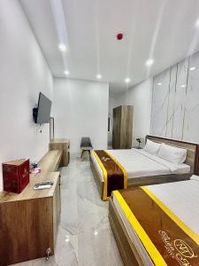 Postel nebo postele na pokoji v ubytování Khách Sạn Thiên Mỹ