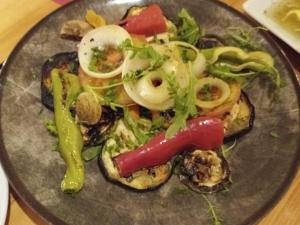 a plate of food with vegetables on a table at House ThoNi in Gornji Štoj