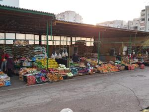 a market with a bunch of fruits and vegetables on display at House ThoNi in Gornji Štoj