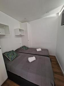 Un pat sau paturi într-o cameră la APARTAMENTO RIBEIRO ALBUFEIRA