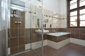 a bathroom with a sink and a shower at Hotel Metamorphis in Prague +75 photos
