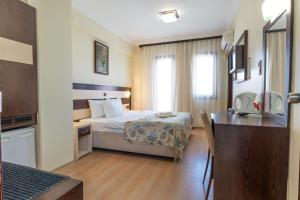 Кровать или кровати в номере Hotel Karacam