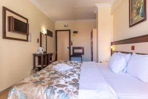 Кровать или кровати в номере Hotel Karacam