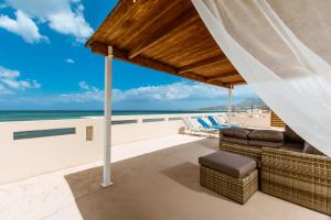 a view of the ocean from the deck of a beach house at Asterina Seaside Apartments in Kalyves