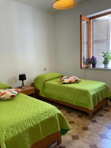 Un pat sau paturi într-o cameră la Villa Carmela