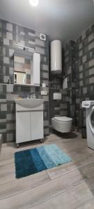a bathroom with a sink and a toilet at Sweet Home in Kyiv +67 photos