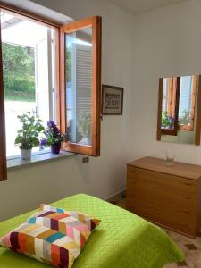 Un pat sau paturi într-o cameră la Villa Carmela