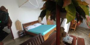 Postel nebo postele na pokoji v ubytování Corto Novo Maison d'hôtes-Camping