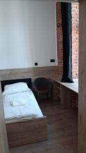 Łóżko lub łóżka w pokoju w obiekcie Aparthotel Łódź 55 Piotrkowska