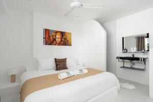 Giường trong phòng chung tại Leelawadee Apartment