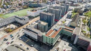 an aerial view of a city with tall buildings at BJØRVIKA APARTMENTS, Damsgård Area, Bergen city center in Bergen