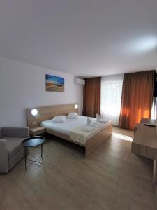 Postel nebo postele na pokoji v ubytování Hotel Gloria