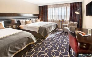 Voodi või voodid majutusasutuse Athlone Springs Hotel toas