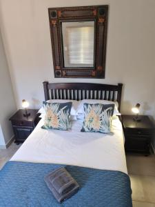 A bed or beds in a room at Lavender Lane Guesthouse