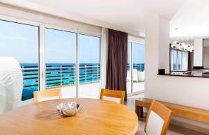 a dining room table with a view of the ocean at Sonesta Ocean Point Resort- All Inclusive - Adults Only in Maho Reef