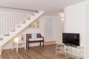 TV a/nebo společenská místnost v ubytování "Panta Rei Luxury House" near Matera UNESCO City