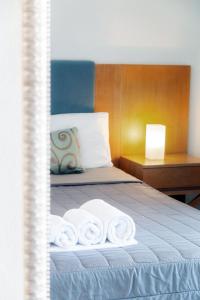 Postel nebo postele na pokoji v ubytování Kapsohora Inn