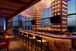 a bar in a hotel with a view of the city at Hyatt Centric Buckhead Atlanta in Atlanta