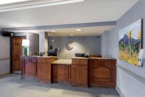 a kitchen with a sink and a counter top at Comfort Inn & Suites Boulder North in Boulder