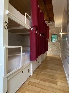 A bunk bed or bunk beds in a room at The Central House Ribeira