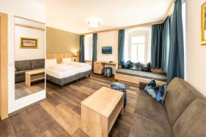 Posteľ alebo postele v izbe v ubytovaní Hotel Heitzmann