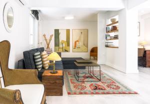 a living room with a couch and a table at SV Acropolis Residence in Athens