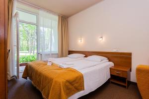 Ένα ή περισσότερα κρεβάτια σε δωμάτιο στο Žuvėdra