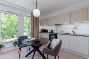 Majoituspaikan EXCLUSIVE Aparthotel Kraków Lubicz 40 keittiö tai keittotila
