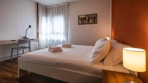 Ein Bett oder Betten in einem Zimmer der Unterkunft Ermes di Colloredo 34 A