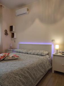 Postel nebo postele na pokoji v ubytování Appartamento incantevole con parcheggio e giardino