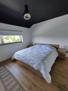 Postel nebo postele na pokoji v ubytování Gîte Sous les vents