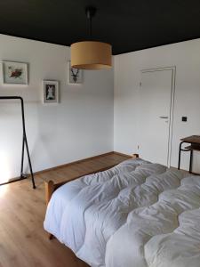 Postel nebo postele na pokoji v ubytování Gîte Sous les vents