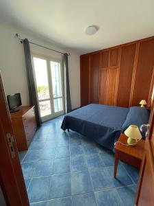 Posteľ alebo postele v izbe v ubytovaní NEREA - Appartamento fronte mare