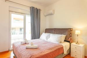 Posteľ alebo postele v izbe v ubytovaní Unique Sea & Sunset Residence
