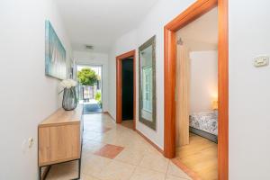 a hallway with a door leading to a bedroom at Modern apartment with private pool in Bibinje +15 photos