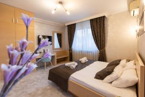 Voodi või voodid majutusasutuse Euro Garni Hotel toas
