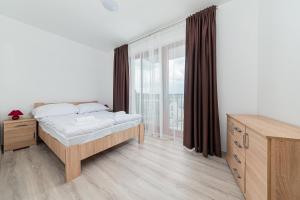 Posteľ alebo postele v izbe v ubytovaní Hérics Apartman