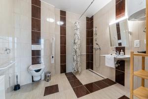 Kúpeľňa v ubytovaní Hérics Apartman