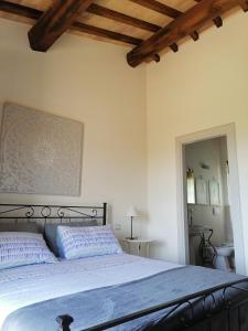 Postel nebo postele na pokoji v ubytování B&B COLdiFIORE