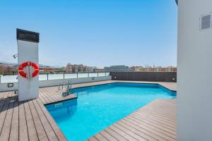 The swimming pool at or close to Modern apartment next to train/bus station
